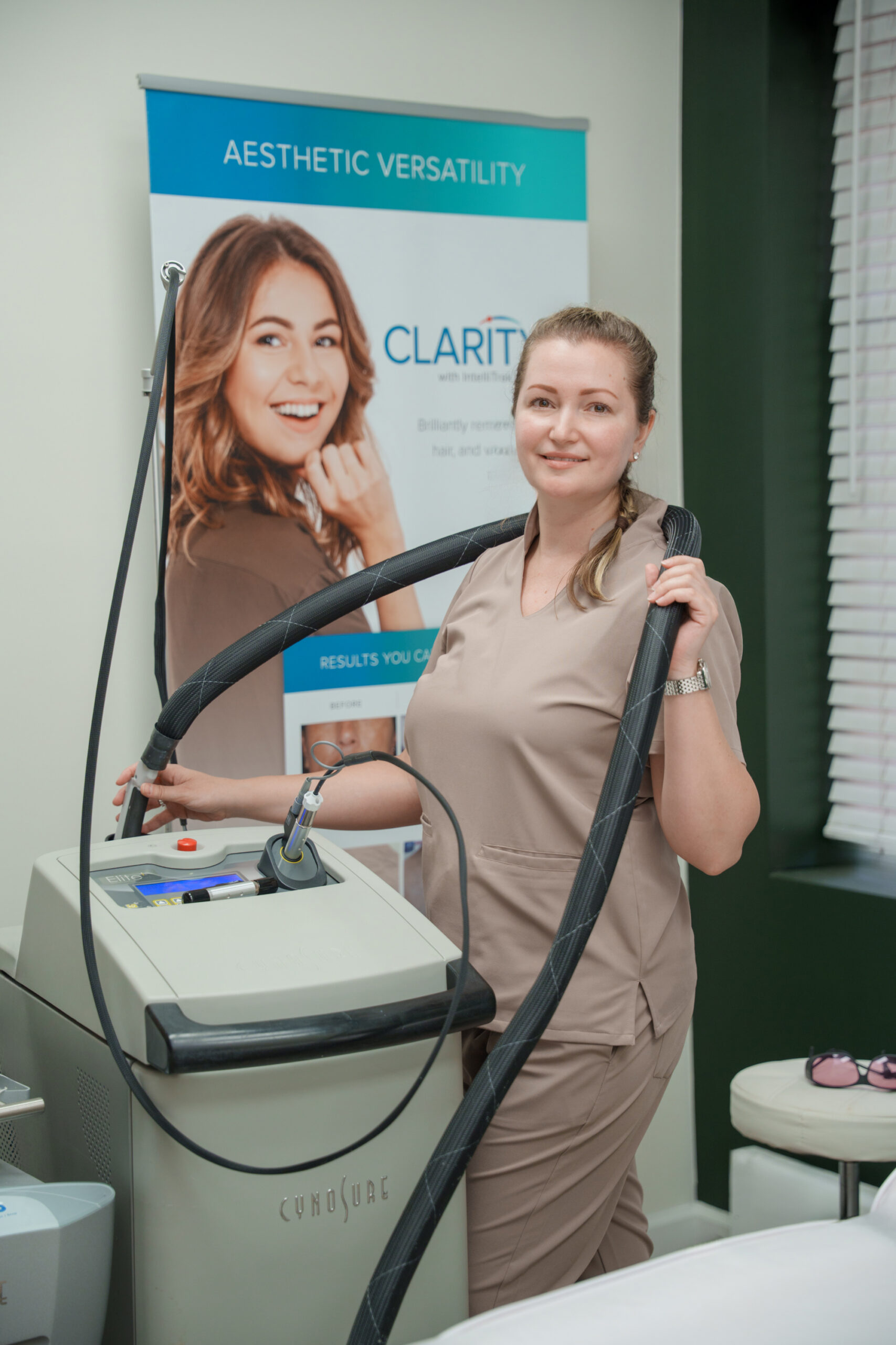 Cynosure Elite+ laser console at Glow Lab, Elite+ and CYNOSURE branding visible