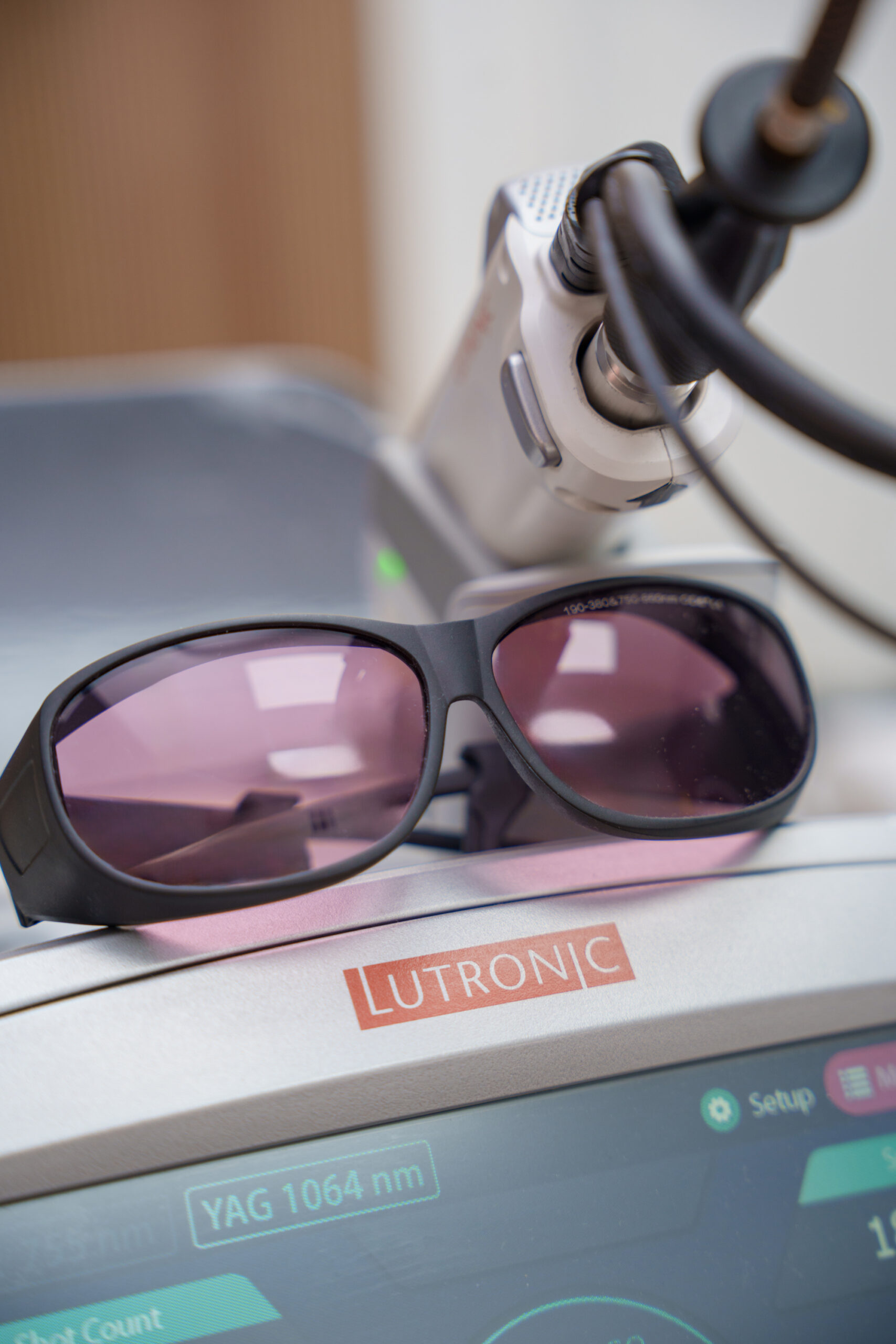 Lutronic Clarity II laser console showing YAG 1064 nm with safety goggles at Glow Lab
